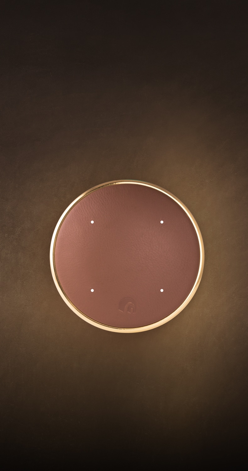 A stylish bedroom with a generous bed and a functional desk, blending comfort and modern design elements seamlessly.